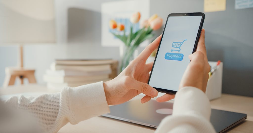 young lady use cellphone order online shopping product paying bills with banking app with transaction successful stay house quarantine activity fun activity coronav PCI DSS для віртуальних платіжних карток